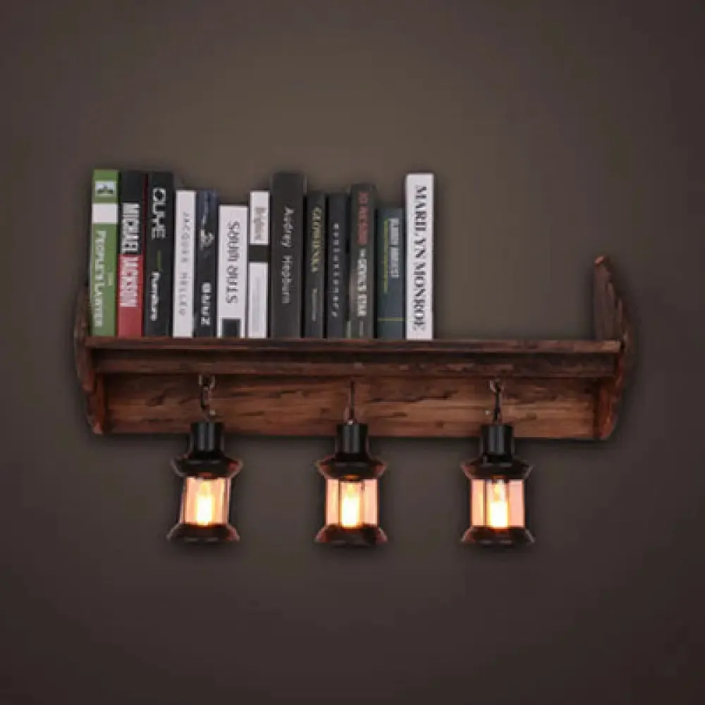 Coastal Style Black Lantern Sconce Light Fixture with Clear Glass and Wooden Bookshelf